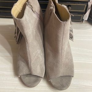 Suede peep toe booties with fringe